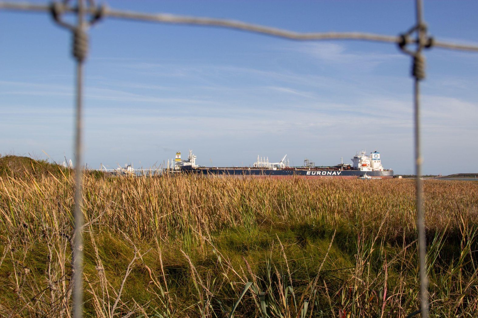 Looking from Ingleside on the Bay’s easternmost boundary, crude oil is loaded into Cap Port Arthur, a Suezmax oil tanker currently sailing under the flag of Greece, at the Enbridge Ingleside Energy Center on January 10th, 2024. McGloin’s Bluff, a site containing various Indigenous artifacts, is in the foreground. (Alex Ip/The Xylom)