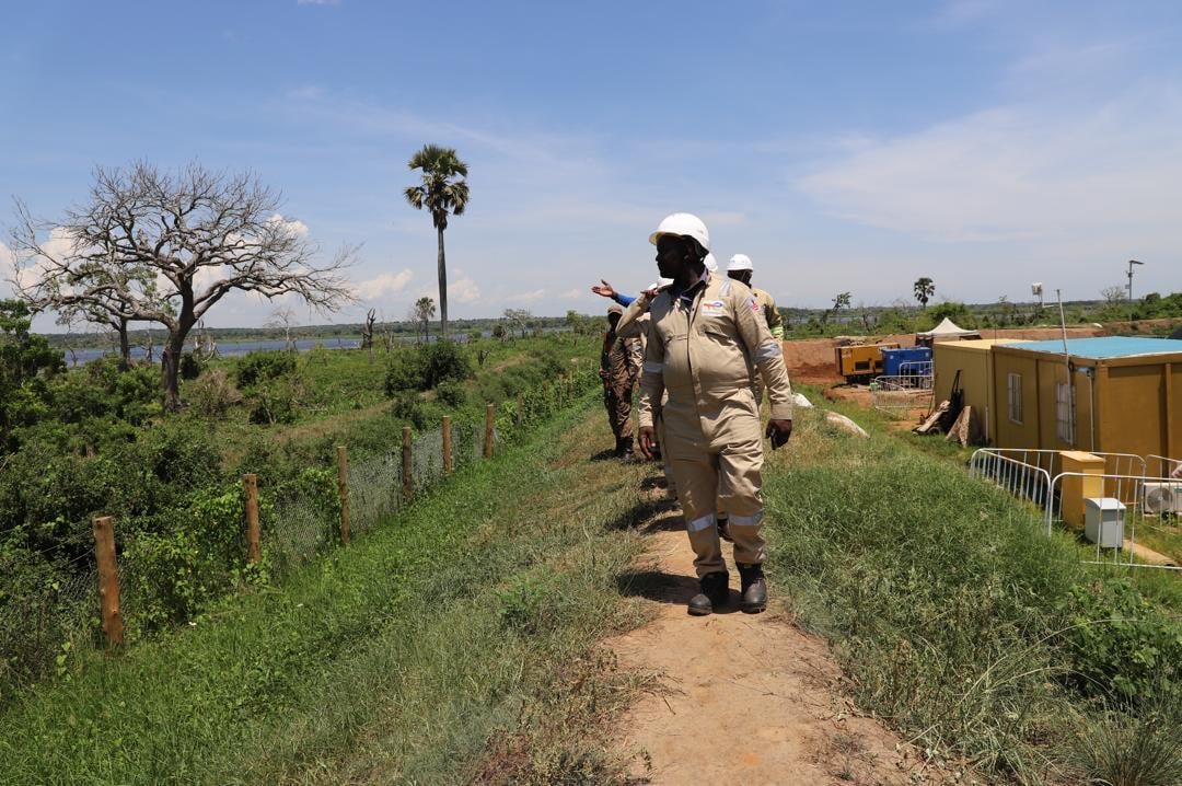 Members of civil society groups inspect the pipeline at a drill site where EACOP crosses the River Nile. Photo: Diana Taremwa-Karakire