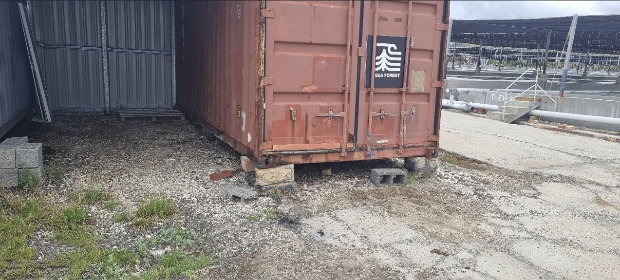 Image showing a shipping container bearing the Sea Forest logo at its Swansea site where the company stored its chemicals for a period of time.