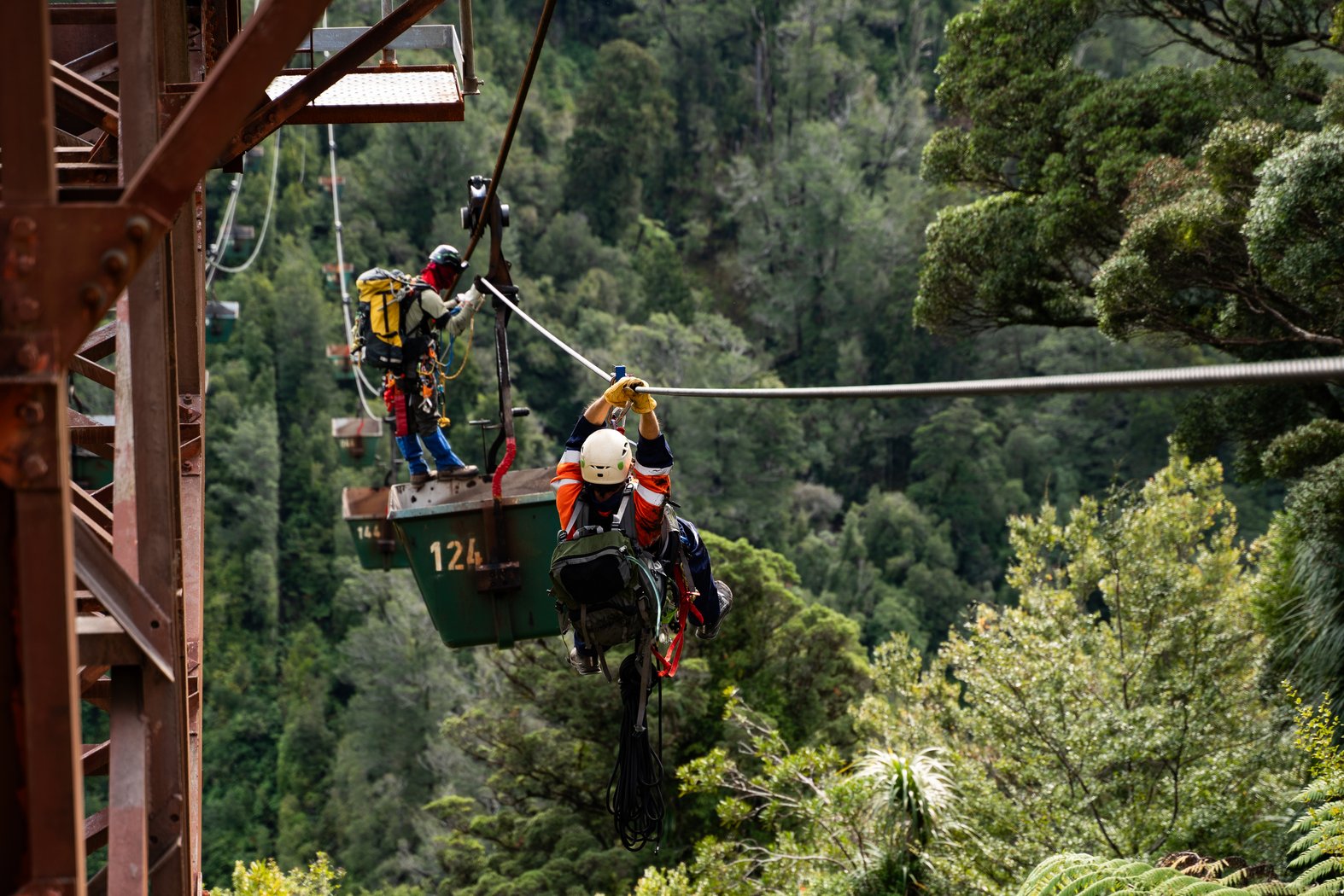 Activists clime the coal ropeway. Photo courtesy Climate Liberation Aotearoa.