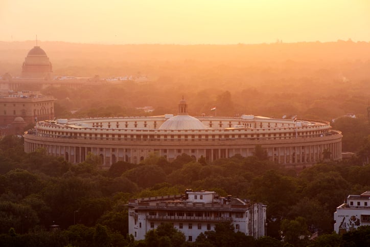 Parliament building in New Delhi, shrouded in polluted air. Credit: Westend61 via Getty Images.